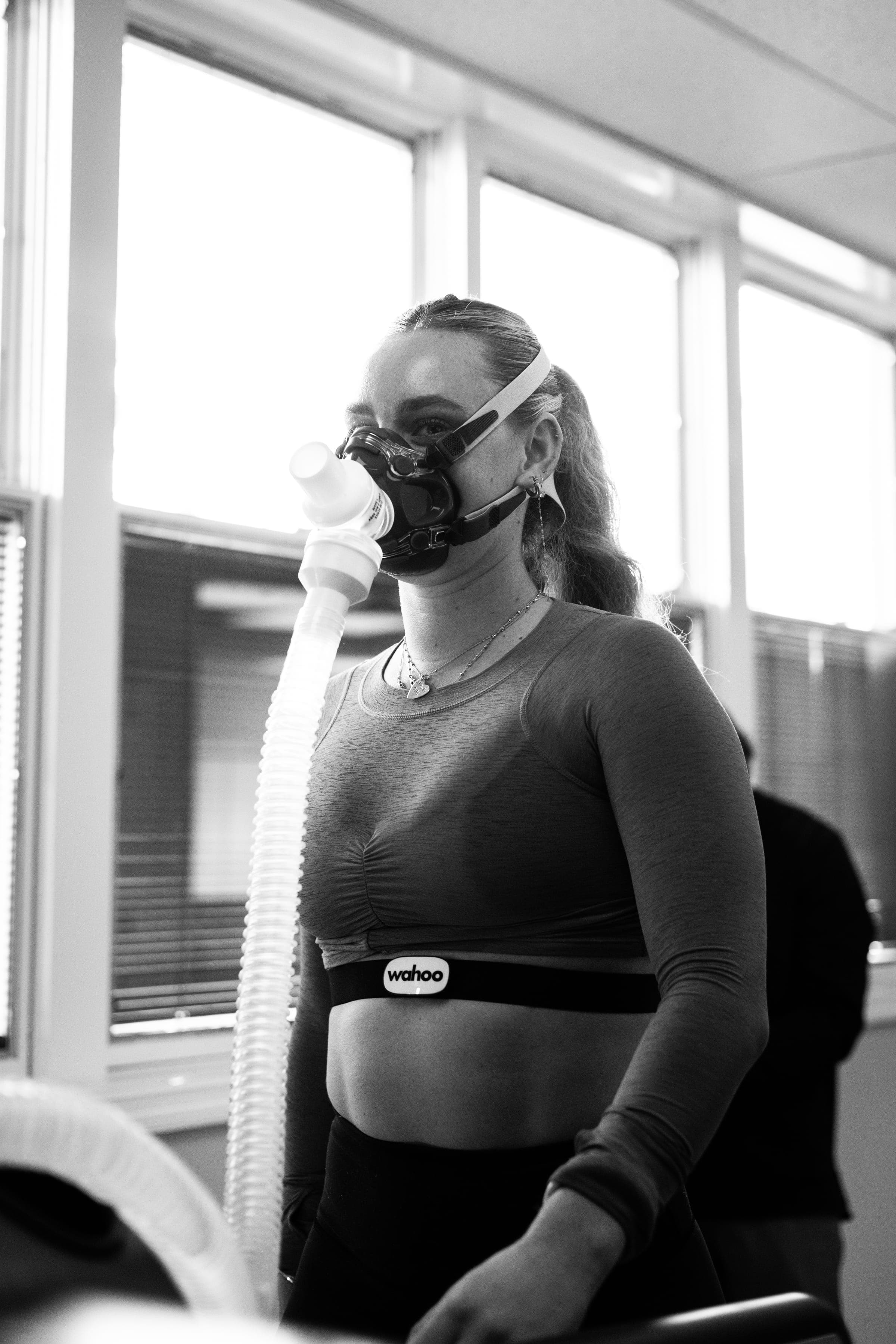 Athlete wearing a VO₂ analysis mask during testing, in black and white