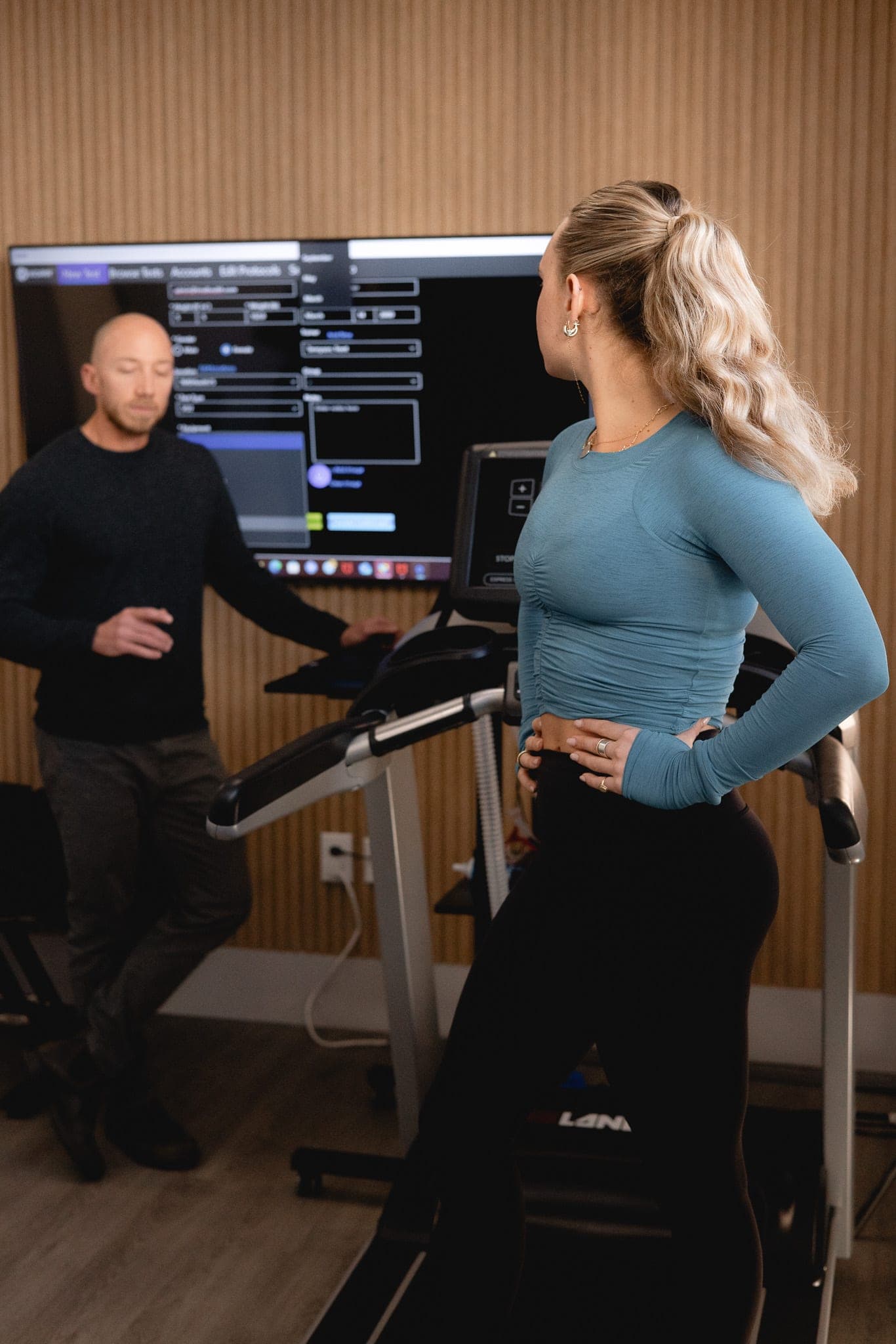 Dr. Tennyson reviewing test results on screen with a patient